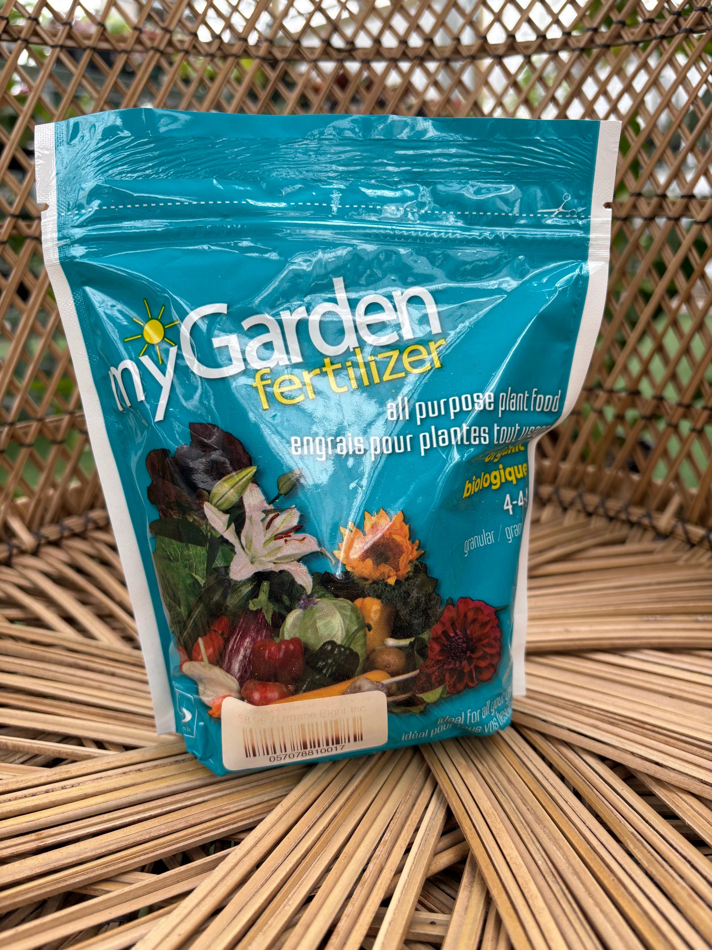 Blue packet of garden fertilizer on a woven surface
