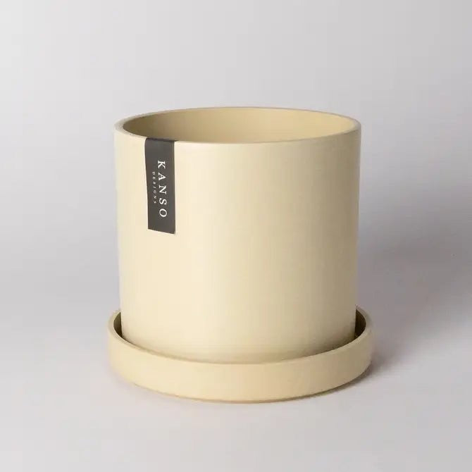 pastel yellow planter with matching tray on a light gray background, featuring the brand 'Kanso' designs