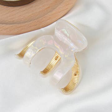 white hair clip with gold interior