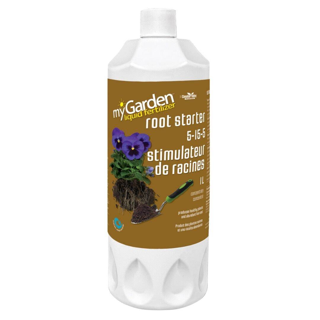 A bottle of myGarden Root Starter liquid fertilizer with a label showing a purple flower and root system. The fertilizer ratio is indicated as 5-15-5.