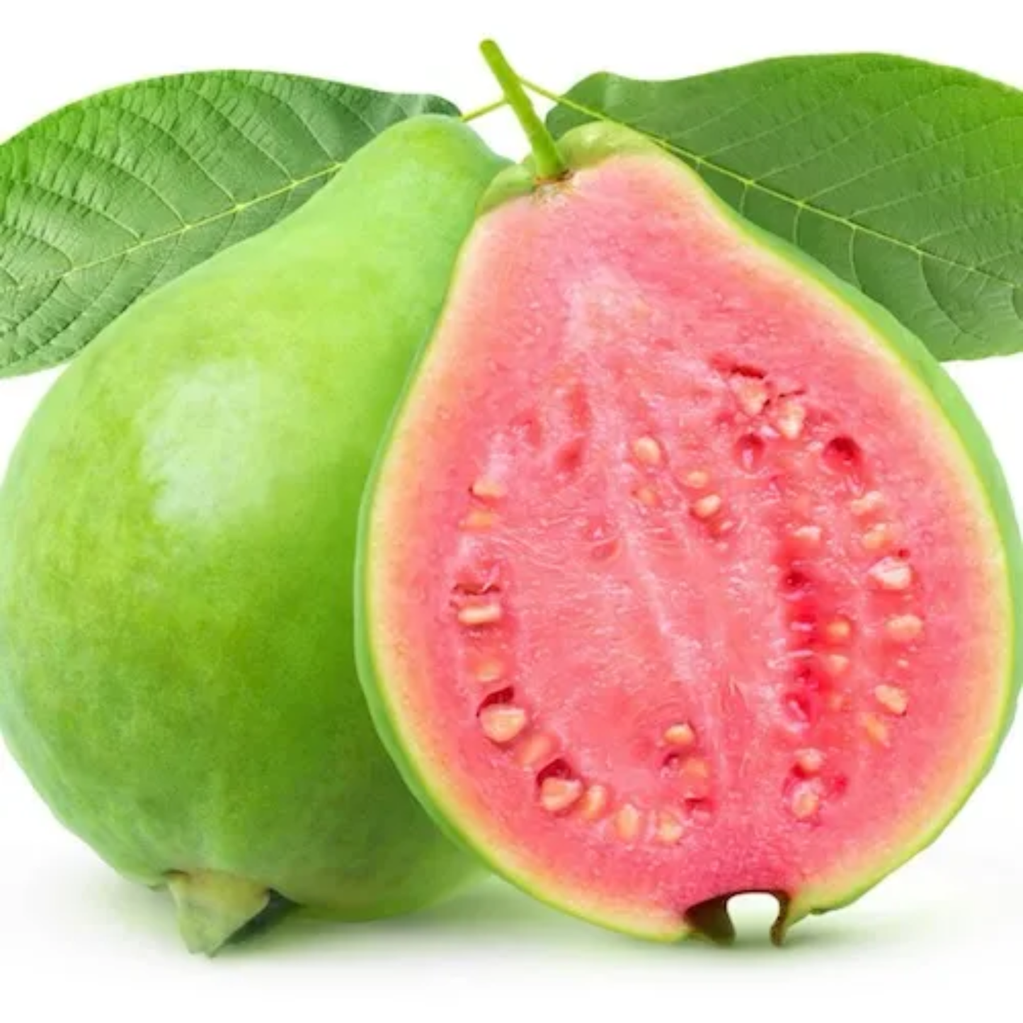 two guavas one full and one cut in half with a green exterior and pink interior