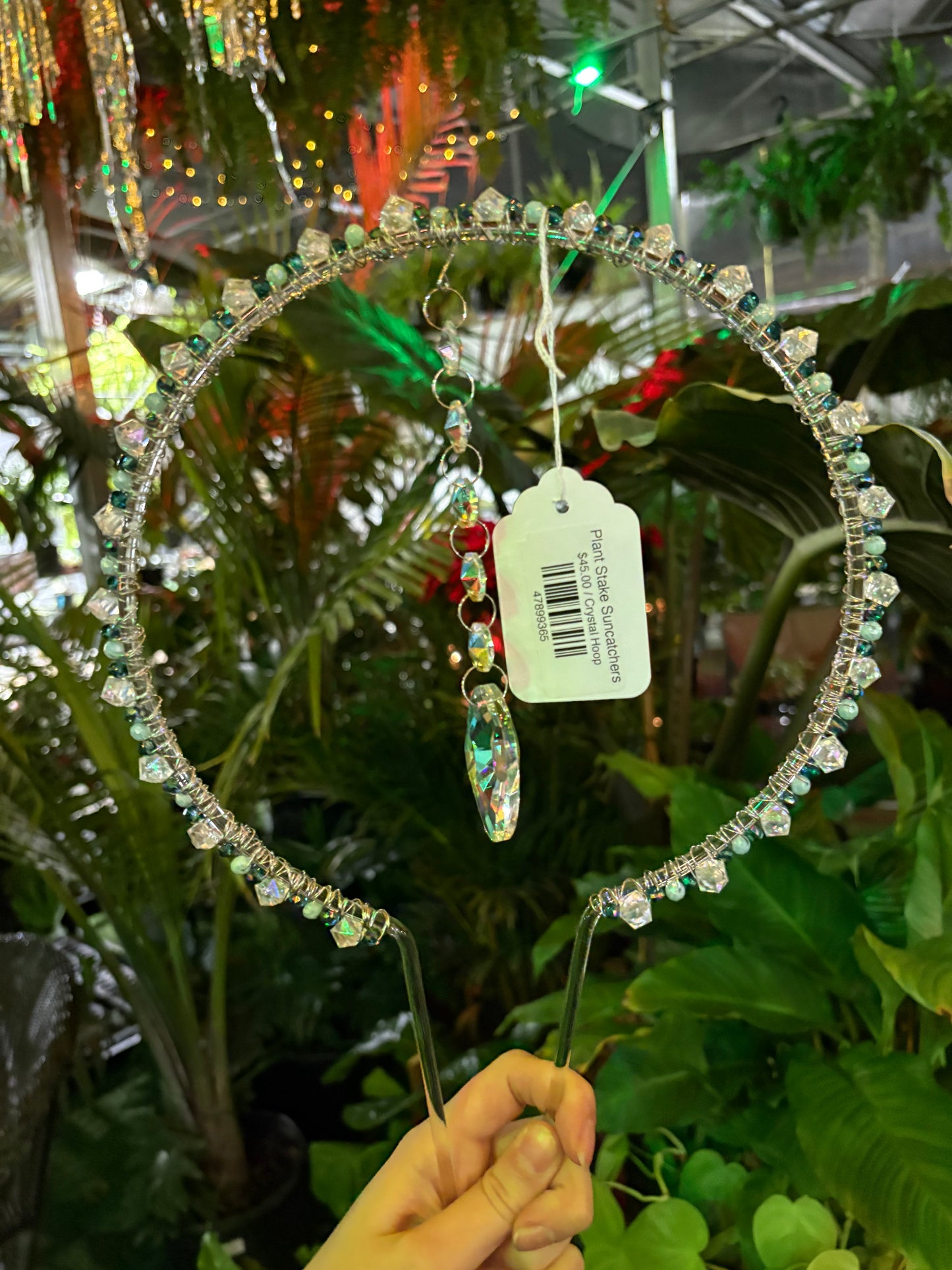 decorative plant stake sun catcher hoop with blue and white crystal beading and a large central hanging crystal