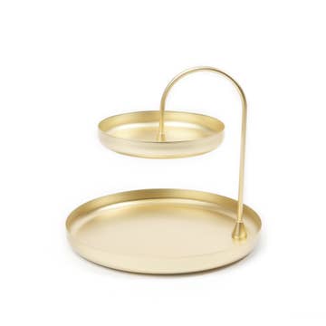 A two-tiered brass tray with a raised design, featuring a matte brass finish and simple, clean lines.