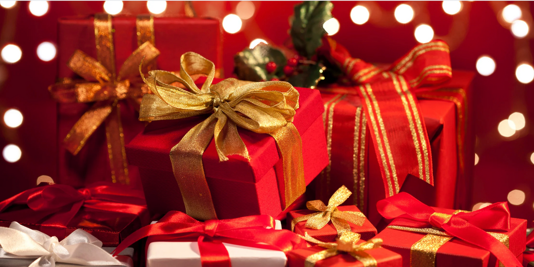 a pile of red and white wrapped Christmas presents with a red background