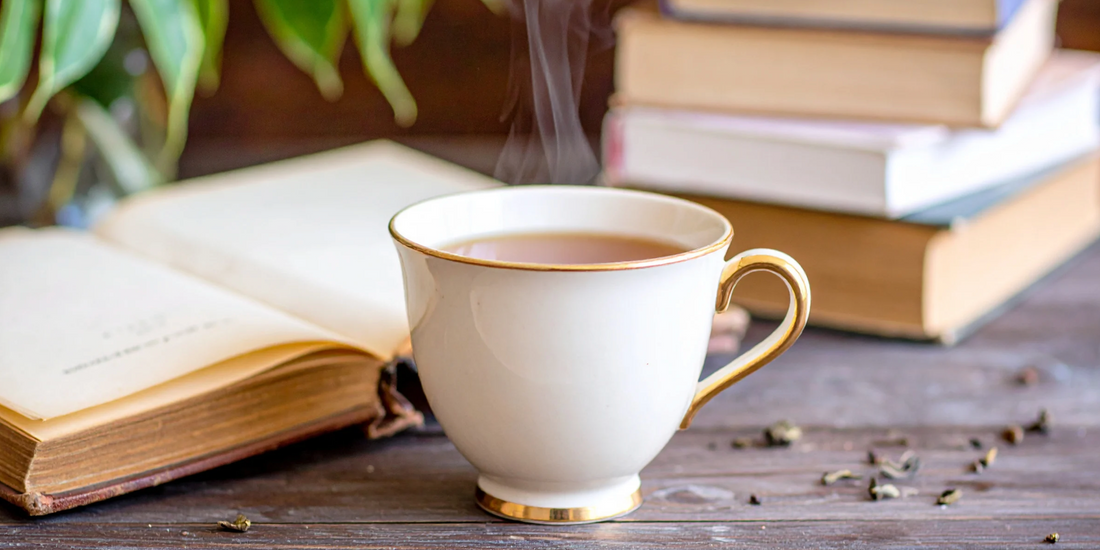 cozy cup of tea on a wooden table surrounded by books and plants