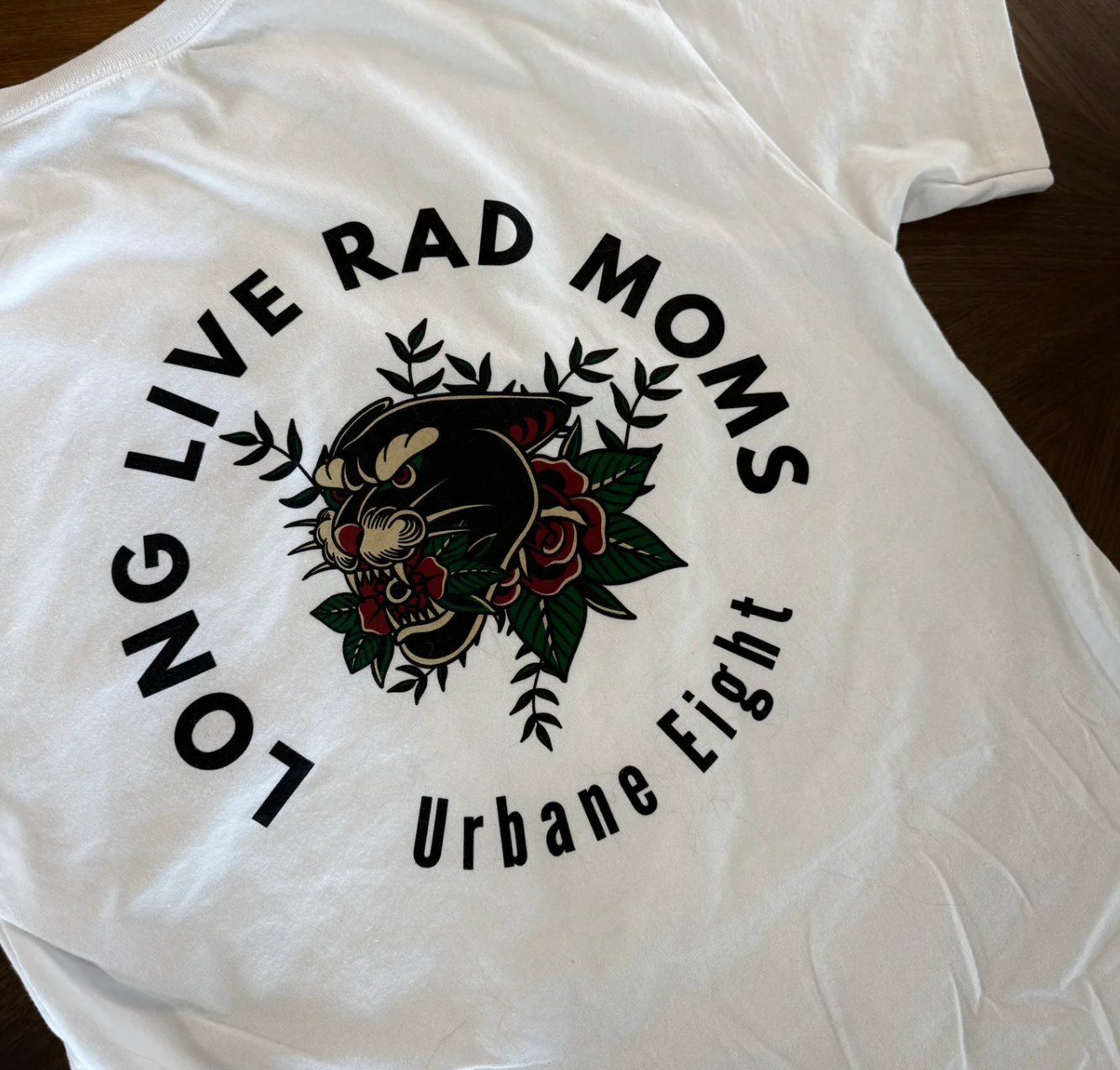 a white t shirt with long live rod moms written on it and an image of a traditional tattoo style puma