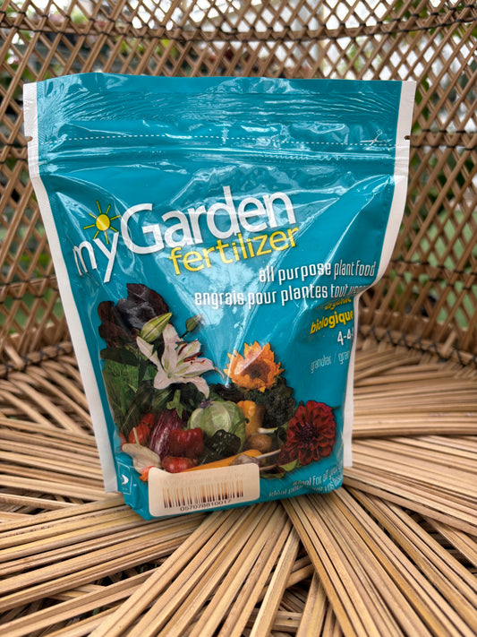 Blue packet of garden fertilizer on a woven surface