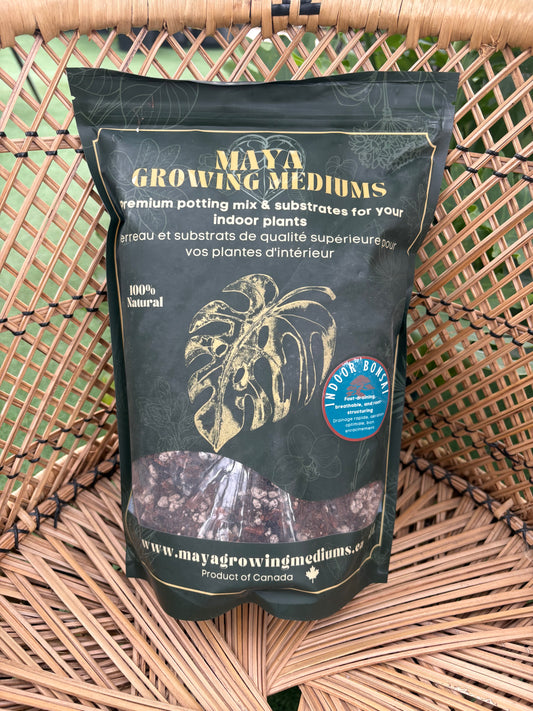 Black bag of Bonzai mix Maya Growing Medium potting mix with branding on a woven surface