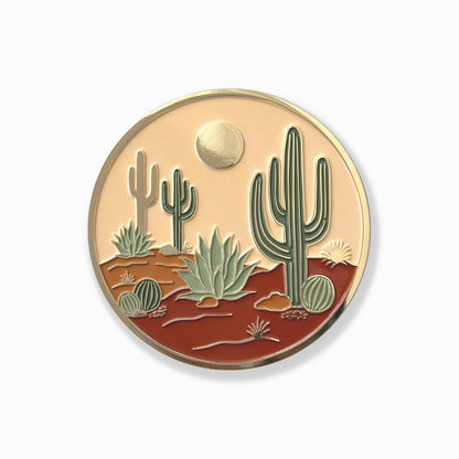 Desert scene coaster with cacti and a sun on a white background