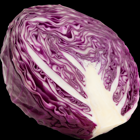 a purple and white cabbage river cut in have displaying its wavy texture with a white core against a black background