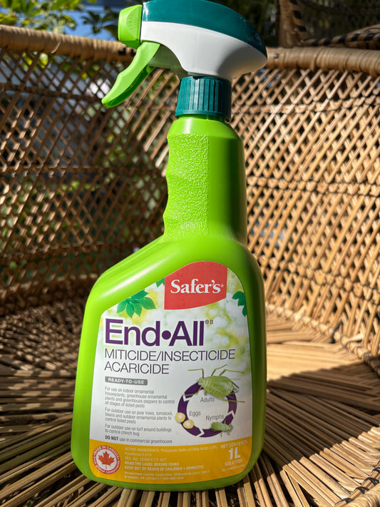 green spray bottle of End-All insecticidal soap sitting on a wicker chair
