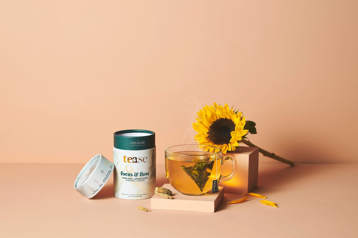 Tease focus and flow Tea packaging with a cup of tea and sunflower on a beige background