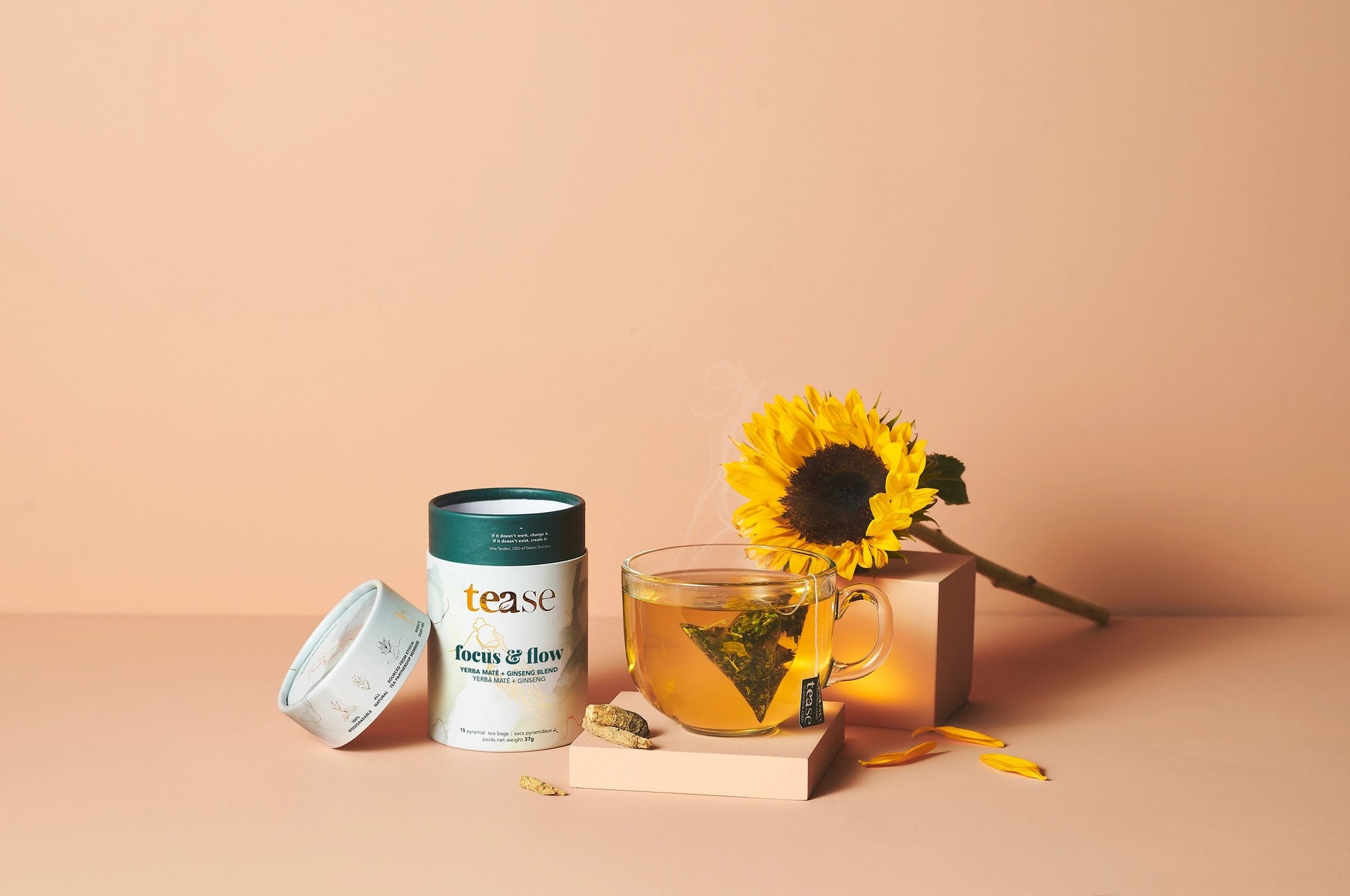 Tease focus and flow Tea packaging with a cup of tea and sunflower on a beige background