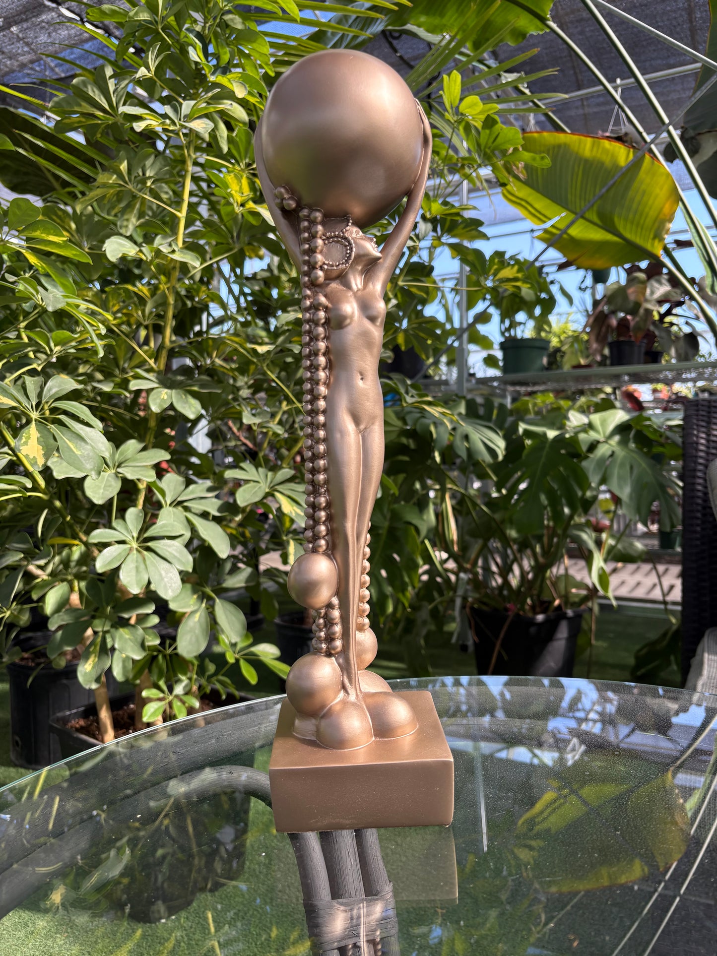 Frank Lloyd Wright Midway Garden Decor bronze statue placed in a greenhouse setting