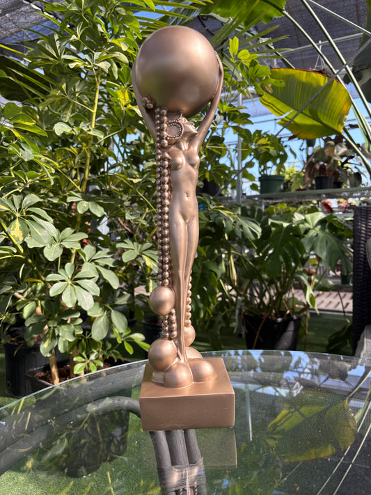 Frank Lloyd Wright Midway Garden Decor bronze statue placed in a greenhouse setting
