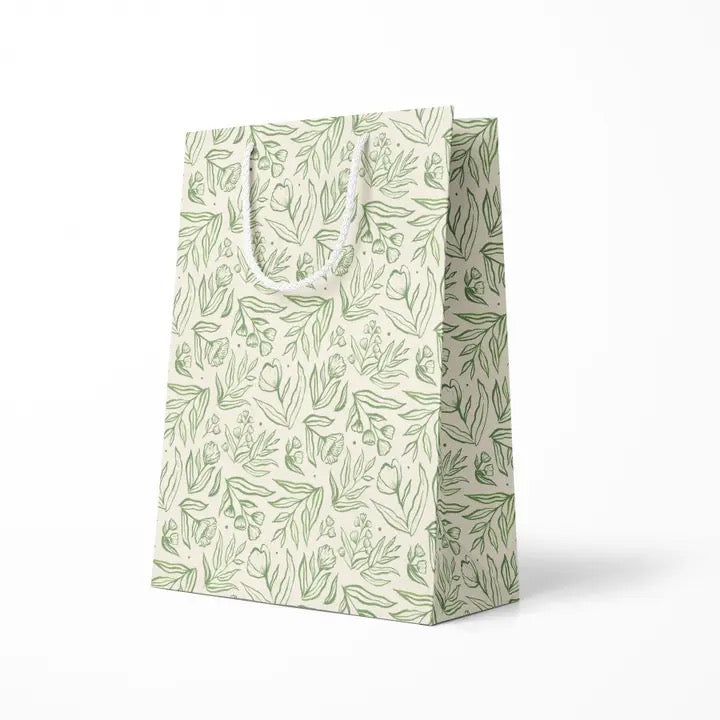 White Gift bag with green leaf pattern on a white background