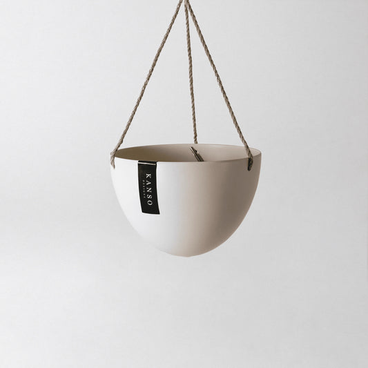 white hanging planter with 'KANSO' designs label on a white background