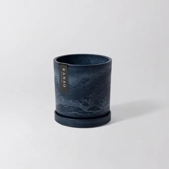 Dark blue marbled planter with 'KANSO' Designs label on a light gray background