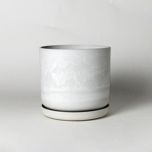 White stone plant pot on a light gray background