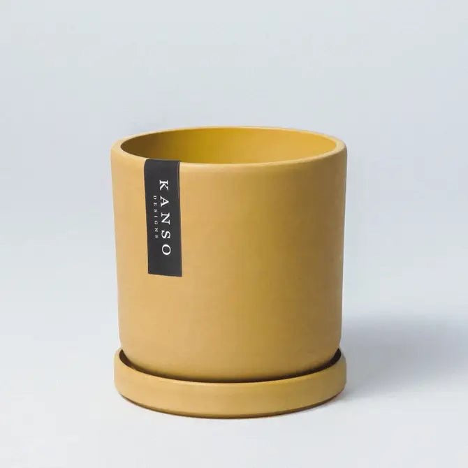 Mustard Yellow planter with saucer on a light gray background, featuring the brand 'KANSO' Designs 