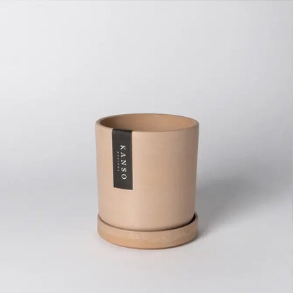 coral pot with a black Kanso Designs label on a white background