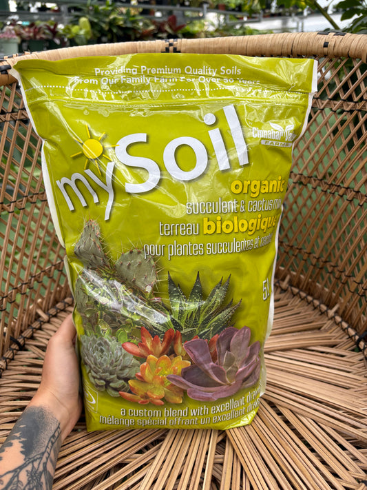 Bag of mySoil organic fertilizer on a woven surface