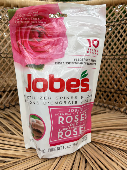 Rose Fertilizer Spikes  sitting on wicker surface