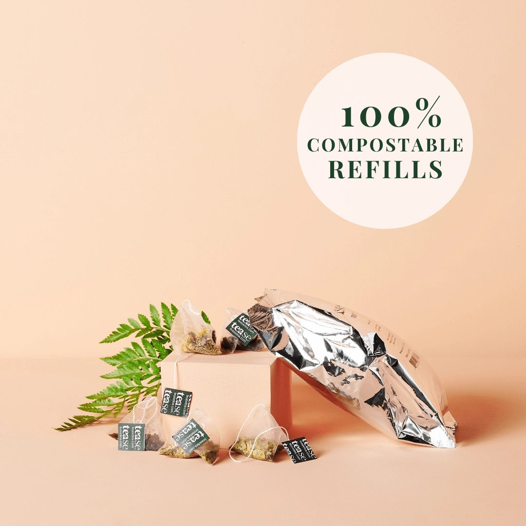 Tea bags with compostable labels on a beige background, featuring text '100% Compostable Refills'.