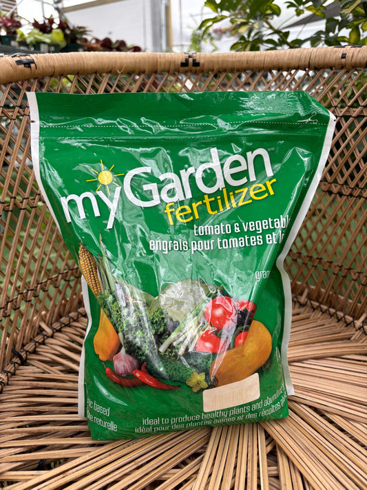 Green bag of garden fertilizer on a wicker surface