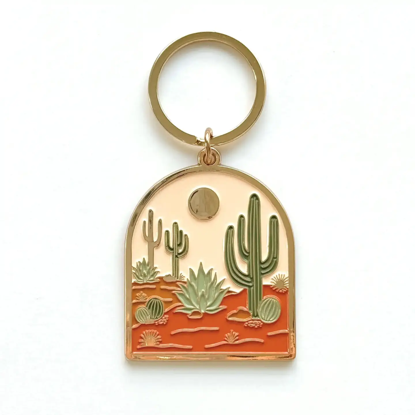 Keychain with desert landscape design featuring cacti on a white background