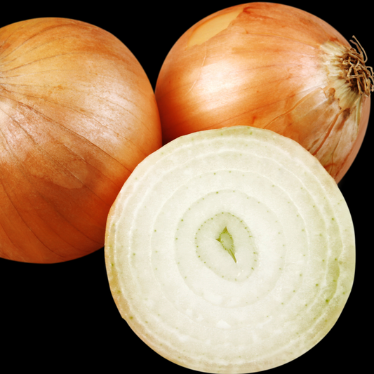 two whole yellow sweet Spanish onions and one cut in half against a black background