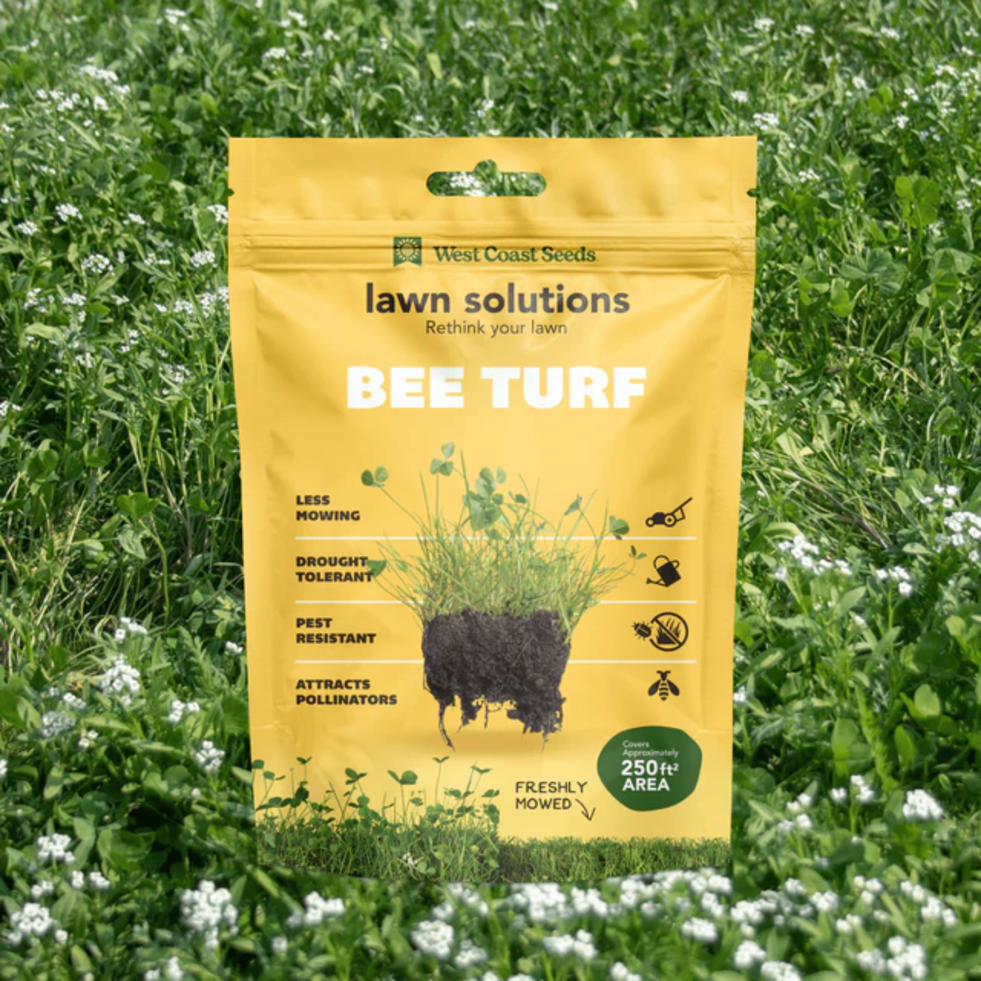 a bright yellow bag of lawn solutions bee turf surrounded by greenery