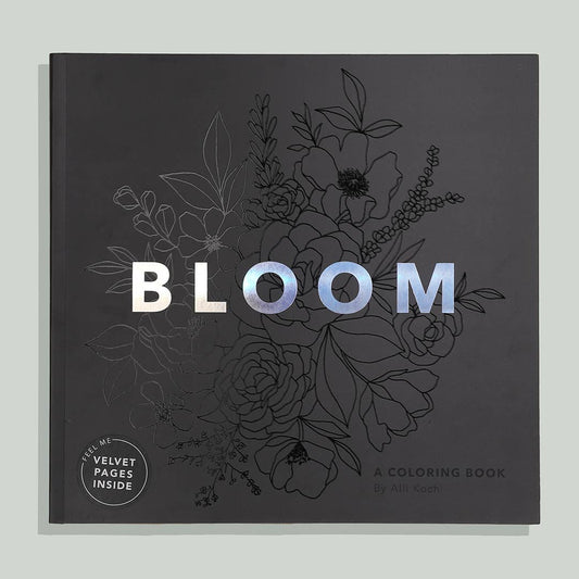 black colouring book with flower details and the word bloom with a white background