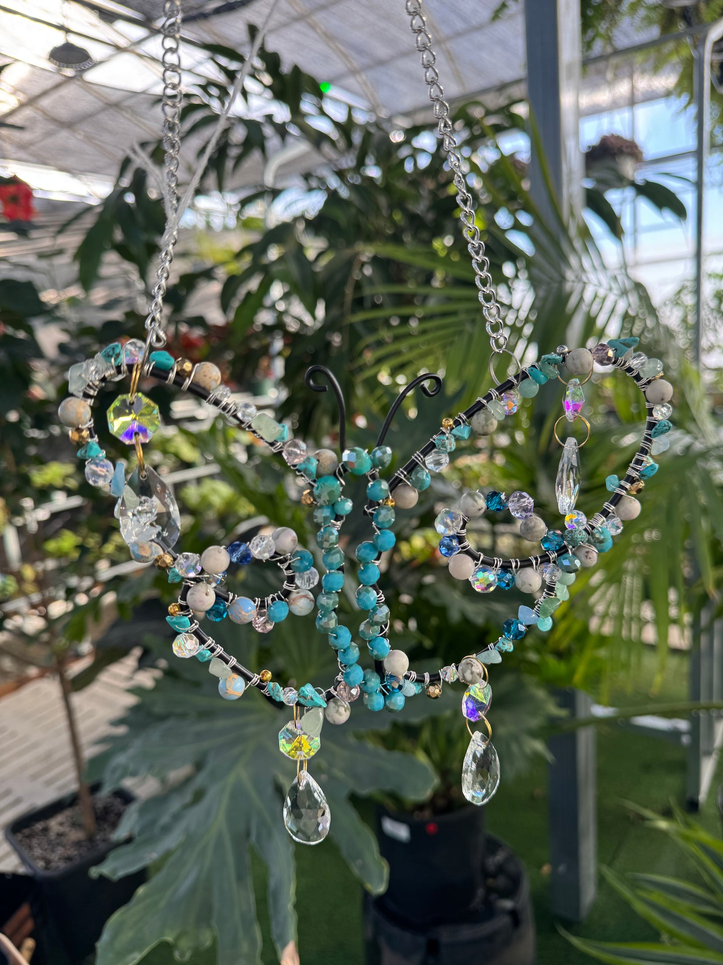 decorative butterfly sun catcher with blue beads and sparkling dangling crystals