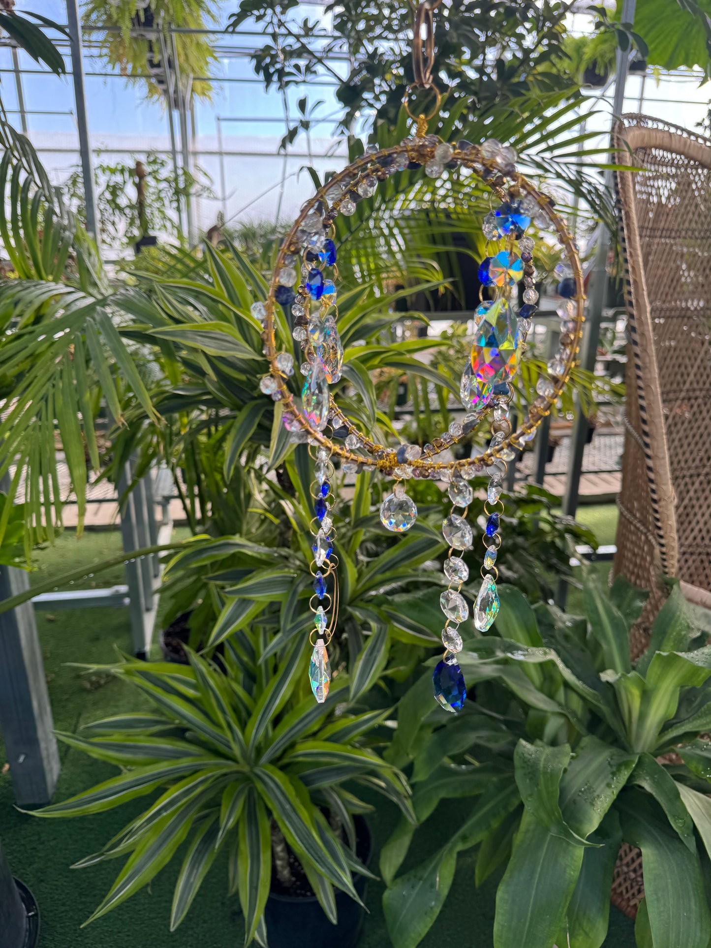 decorative blue and white spare sun catcher with beading and sparkling, dangling crystals