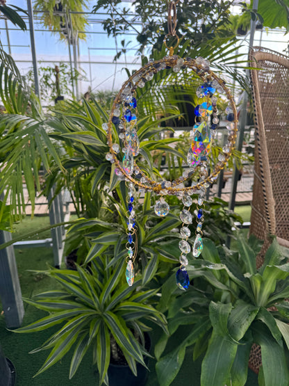 decorative blue and white spare sun catcher with beading and sparkling, dangling crystals