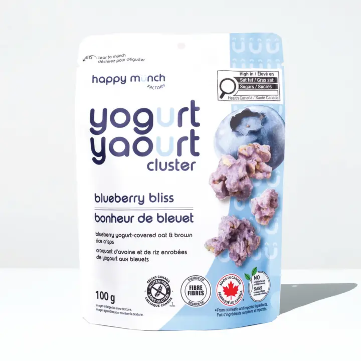 a package with an blue side of happy munch yogurt clusters blueberry bliss with an image of blueberry and clusters against a white background