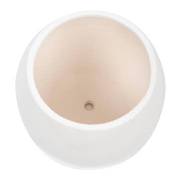 a true design white ceramic planter from top view against a white surface