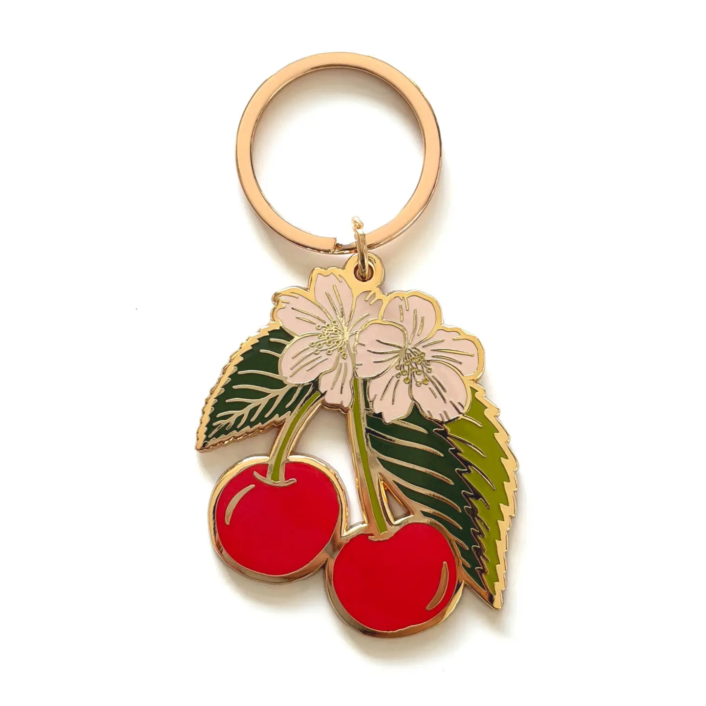 a cherry keychain featuring red cherries green leaves and white blossoms on a white background