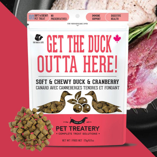 Packaging of Duck & Cranberry Soft Dog Treats with an image of the treats and a duck, against a background of a cooked duck and cranberry sauce.