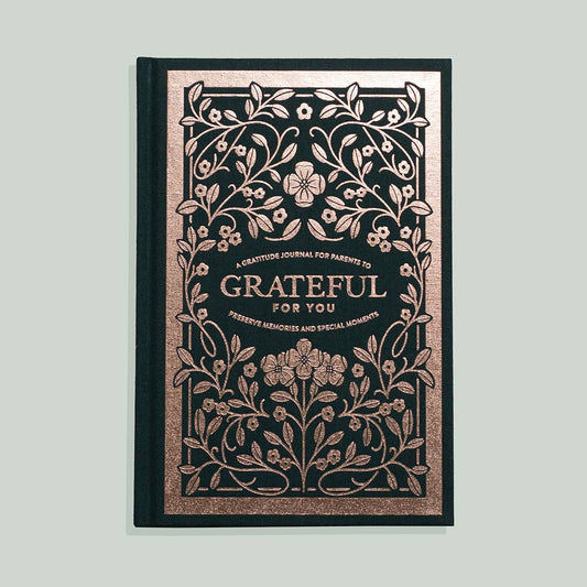 A gratitude journal with a floral design on the cover, titled 'Grateful For You'.