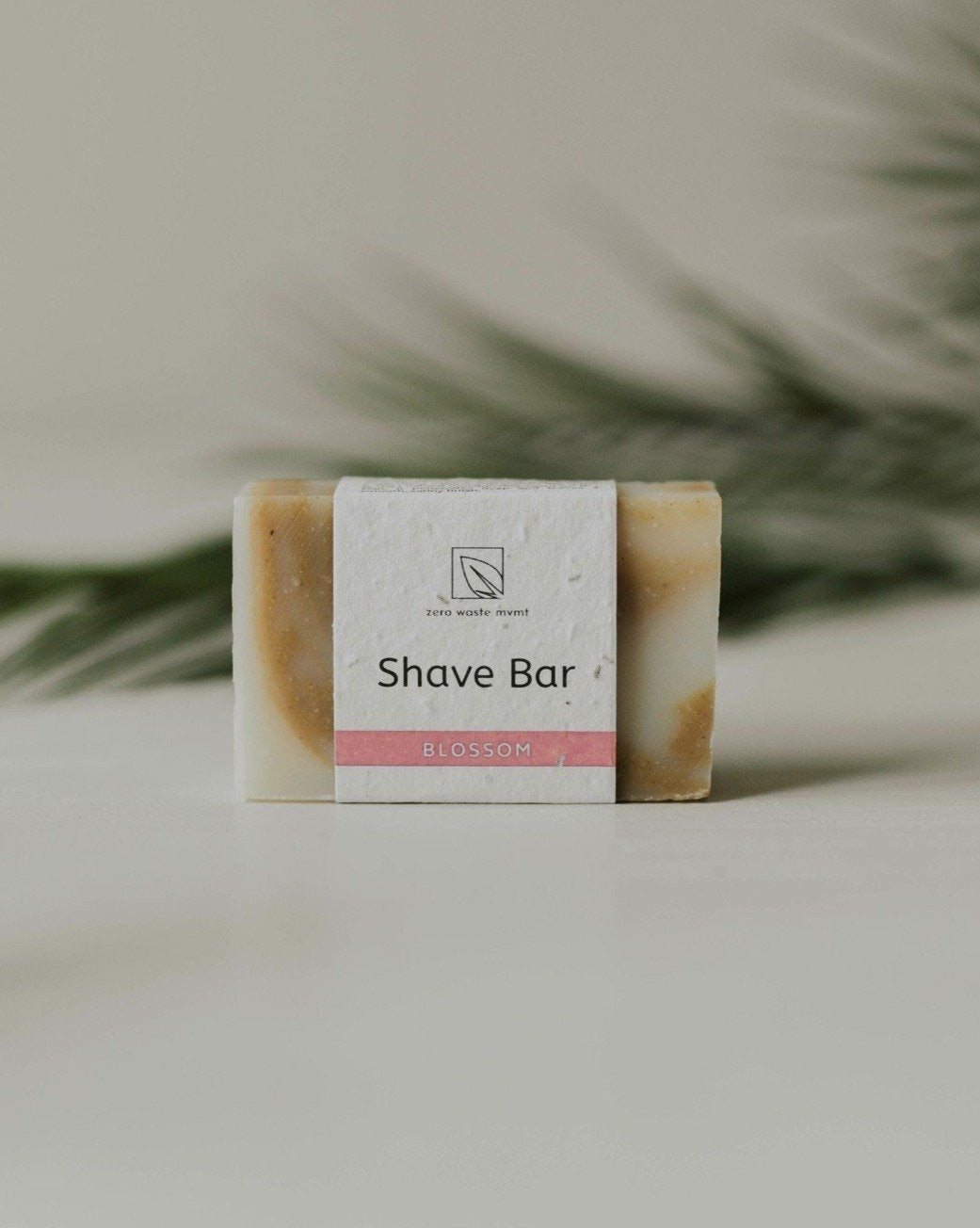 a shave bar handmade soap bar resting on a white surface