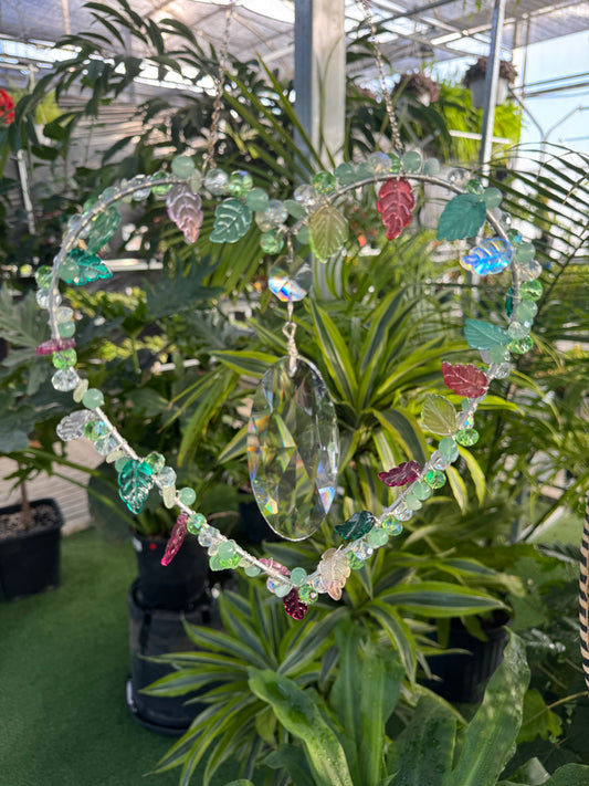 decorative heart sun catcher with a large clear crystal in the centre