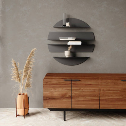 a black round solis wall shelf hung on a grey wall surrounded by furniture
