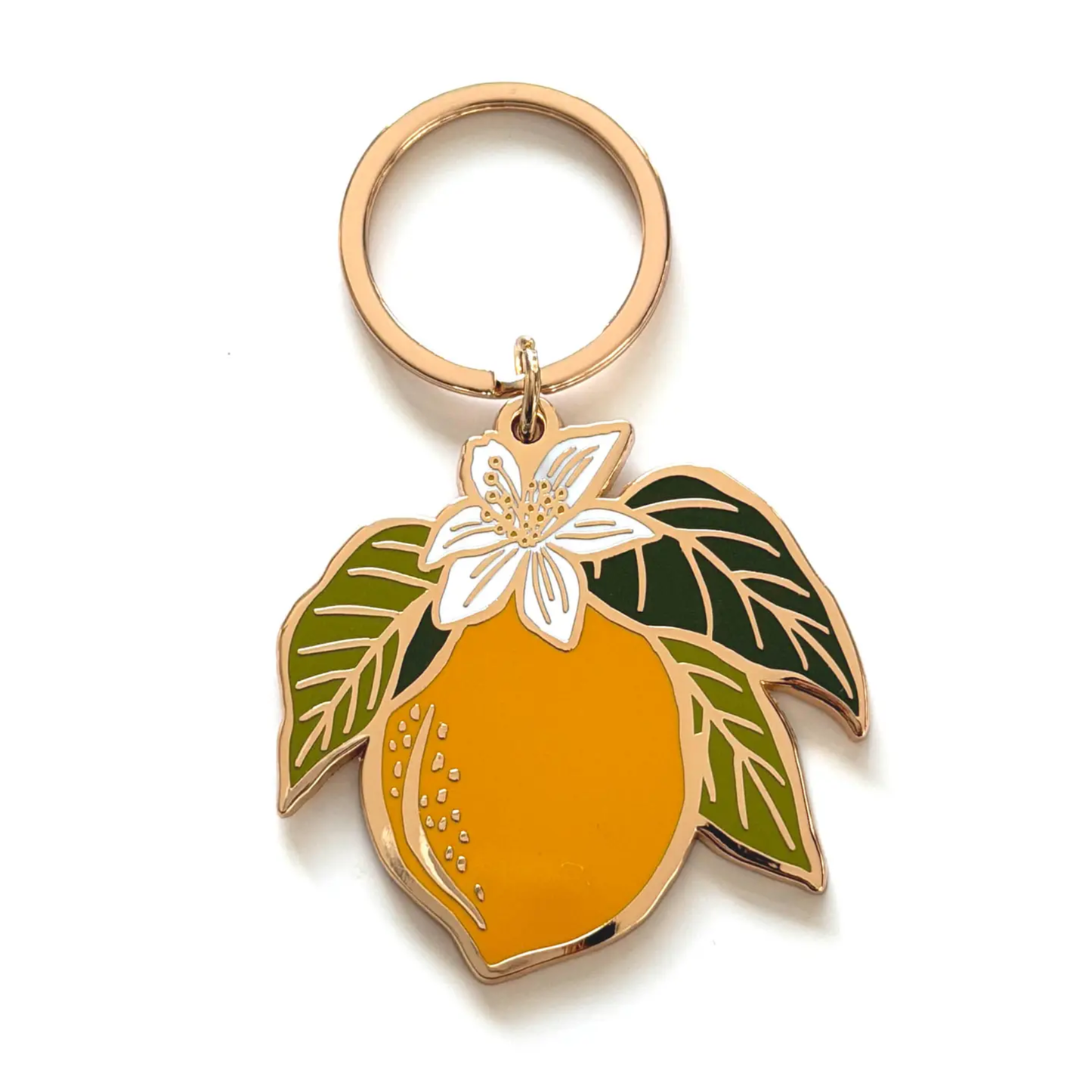 Lemon-shaped keychain with leaves on a white background