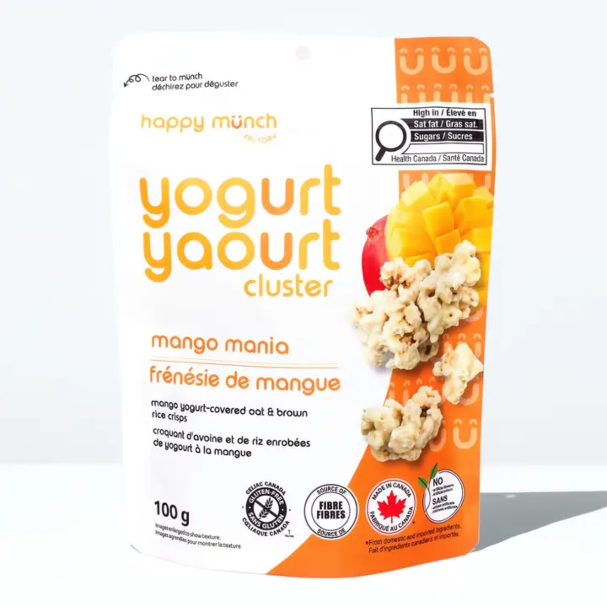 a package with an orange side of happy munch yogurt clusters mango mania with an image of mango and clusters against a white background