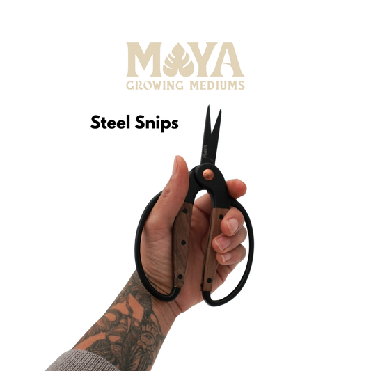 an image of someone with tattoos holding a pair of black steel plant snips with wood on the handle 