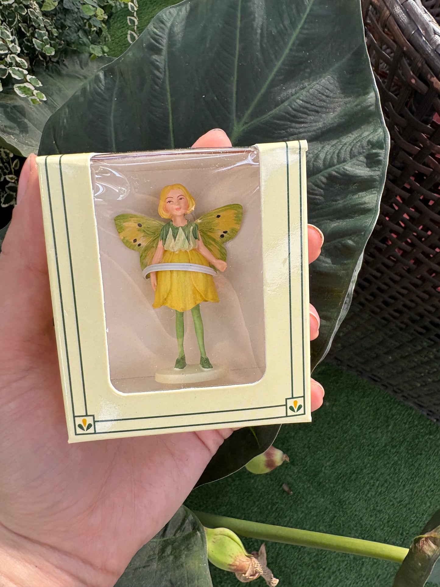 a small fairy figurine in plastic packaging