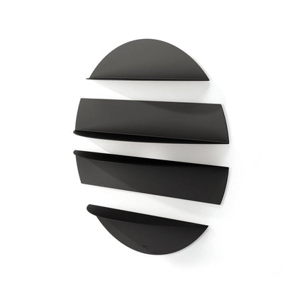 a round black solis wall held hung on a white wall