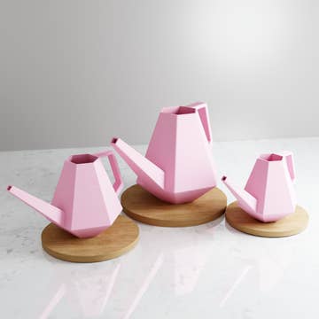 three pink geometric watering cns of different sizes
